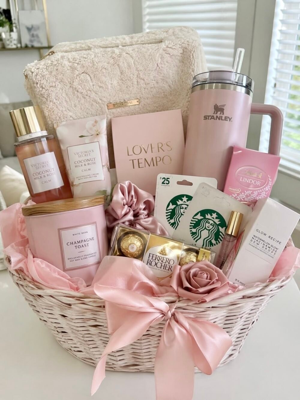 Best Mother’s Day Gifts 2026 - Luxury pink gift basket with skincare, perfume and flowers.
