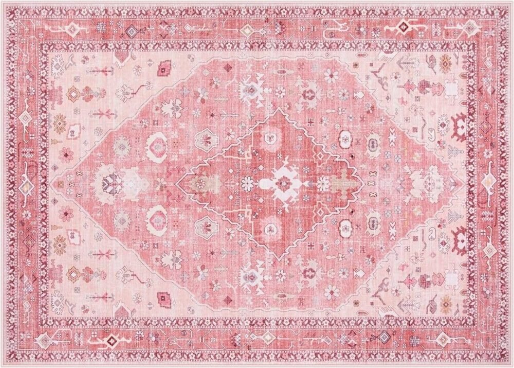 traditional-style area rugs in various shades of pink and mauve, featuring intricate geometric and medallion patterns with a distressed, vintage look.